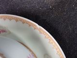 a close up of a plate and a bowl on a table