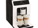 a close up of two cups of coffee in front of a coffee machine