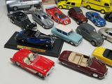 a lot of toy cars that are on a table