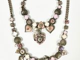 pink and silver necklace and bracelet set with heart charms