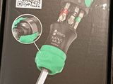 a black box with a green sticker on it