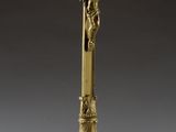 brass crucift with jesus on the cross on a pedestal