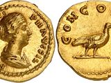 a gold coin with an image of a woman and a bird on it