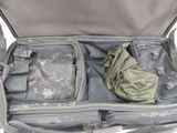 an open suitcase with some items inside of it