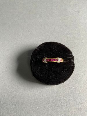 Bague en or jaune et or gris 18K sertie d'une ligne de 8 pie…