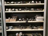 many electronic devices on the shelves in the room