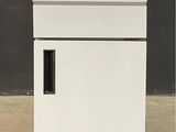 an image of a white refrigerator with a black door