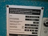a sign on the side of a blue machine