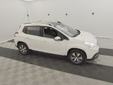 the small white car is parked in the garage on the floor