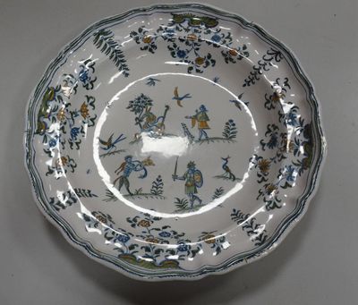a white plate with blue flowers and birds on it