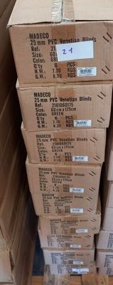 several boxes stacked on top of each other in a room