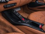 the interior of a sports car with leather seats and dashboard controls