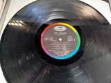 an old record with a label on it sitting on top of a table