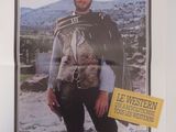 affiche de cinéma représentant un homme en tenue de cow-boy, un pistolet à la main