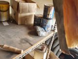 a box of paint and a pair of scissors sitting on a table