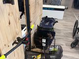 a display of luggage and a bike in a store
