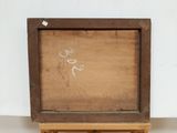 an old wooden easel with a painting of a man on it