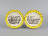 two yellow and white plates with a picture of a farm scene on them