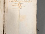 an open book with writing on it sitting on top of a table