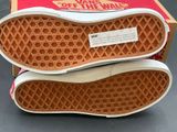 pair of vans off the wall slip ons in a box