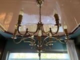 a chandelier hanging from the ceiling in a room