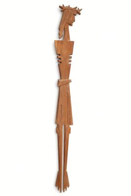 a wooden sculpture of a man with a horse on his head