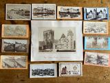 a lot of old postcards on a wooden table