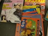 a lot of books that are on the table