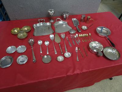 a red table with a red table cloth and silverware on it