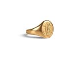 a close up of a gold signet ring on a white background