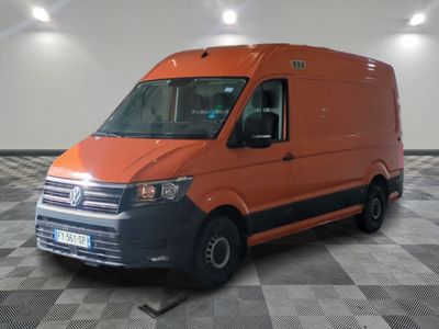 an orange van that is parked in a room