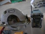 someone is using a circular saw to cut a piece of wood