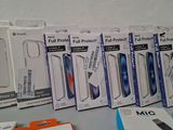 several boxes of apple products sitting on top of a table next to a pair of scissors and a pair of scissors