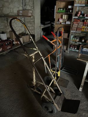 a hand truck that is sitting in the middle of a room