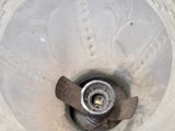 a close up of a blender with a liquid inside of it