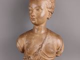 marble bust of a woman with braided hair on a pedestal