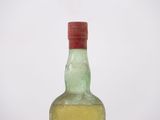a bottle of alcohol that is sitting on a table