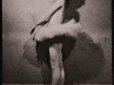 black and white photograph of a woman in a tutu posing for a picture