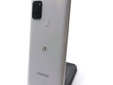 the back of a white samsung galaxy note 10 lite with a camera on top of it