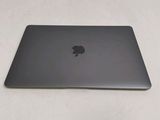 an apple macbook pro laptop sitting on top of a white table
