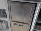 a silver refrigerator with a silver door in a kitchen