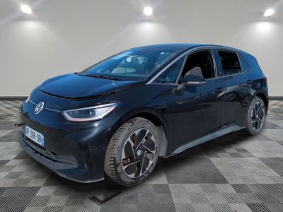 a blue toyota mira hybrid parked in a room with checkered floor