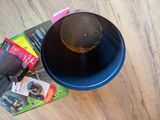 a blue bowl with a brown hat on top of it