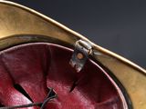 a red and gold clock on a black background