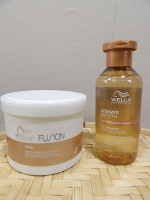 a bottle of lotion and a container of lotion sitting on a table