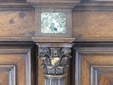 a wooden cabinet with a clock on top of it