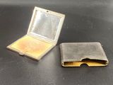a small metal box with a mirror on top of it