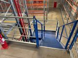 a metal staircase going up to the top of a building