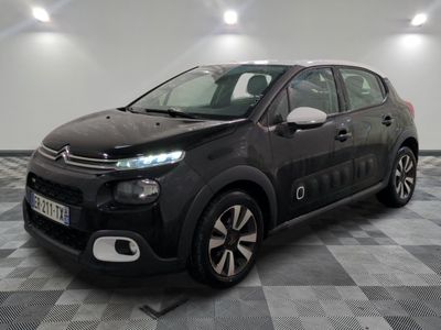 the black citrole is parked on a checkered floor