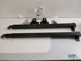 a close up of a pair of black rail brackets on a counter